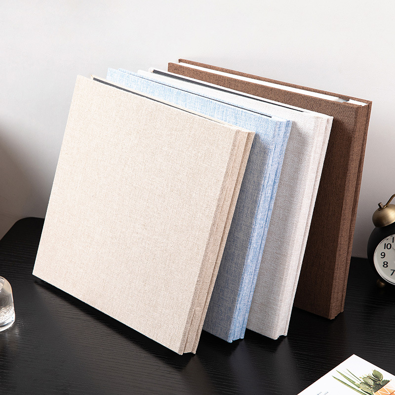 MYKEEPO linen albums standing side by side on a shelf